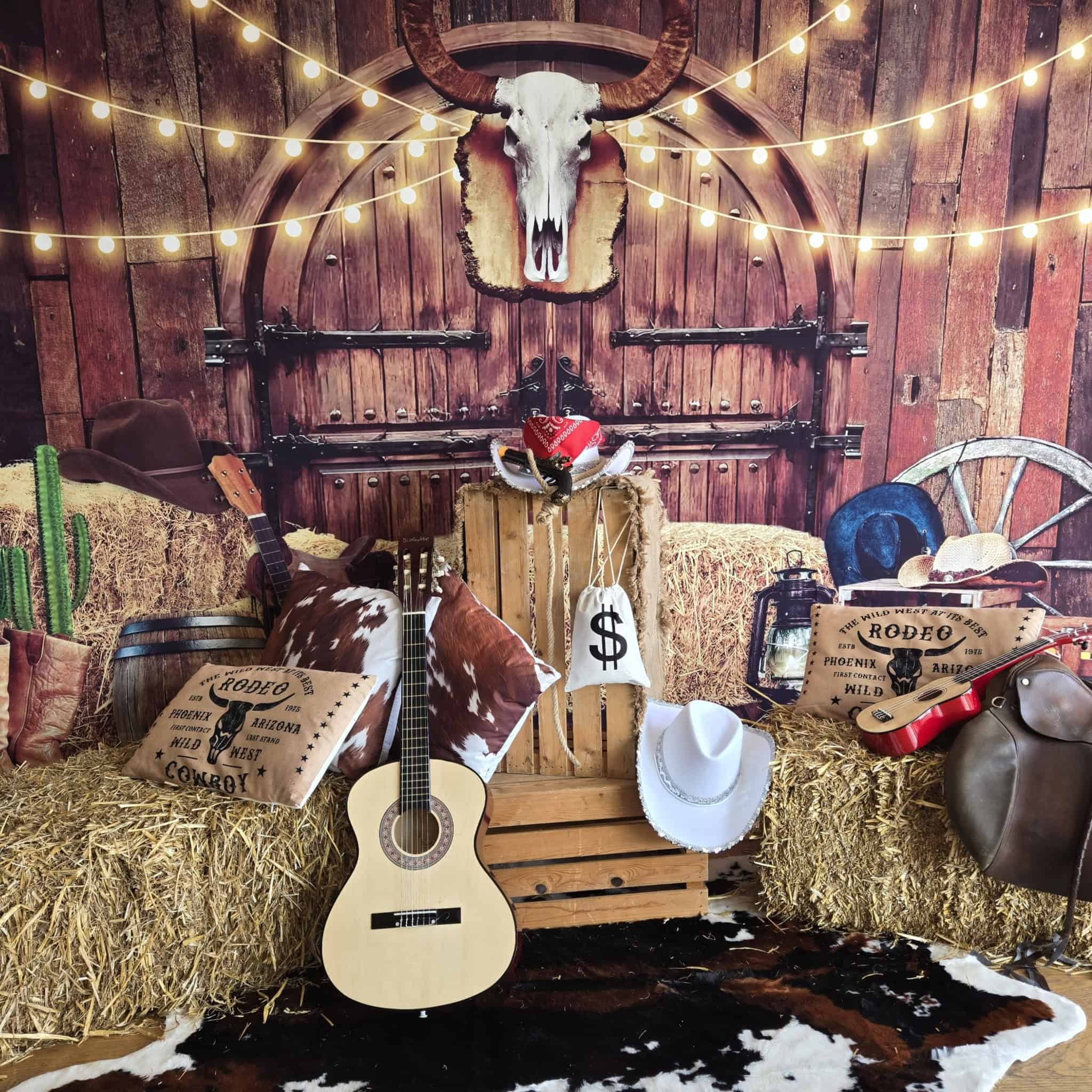 Wild West themed event décor with hay bales, guitars and rustic props