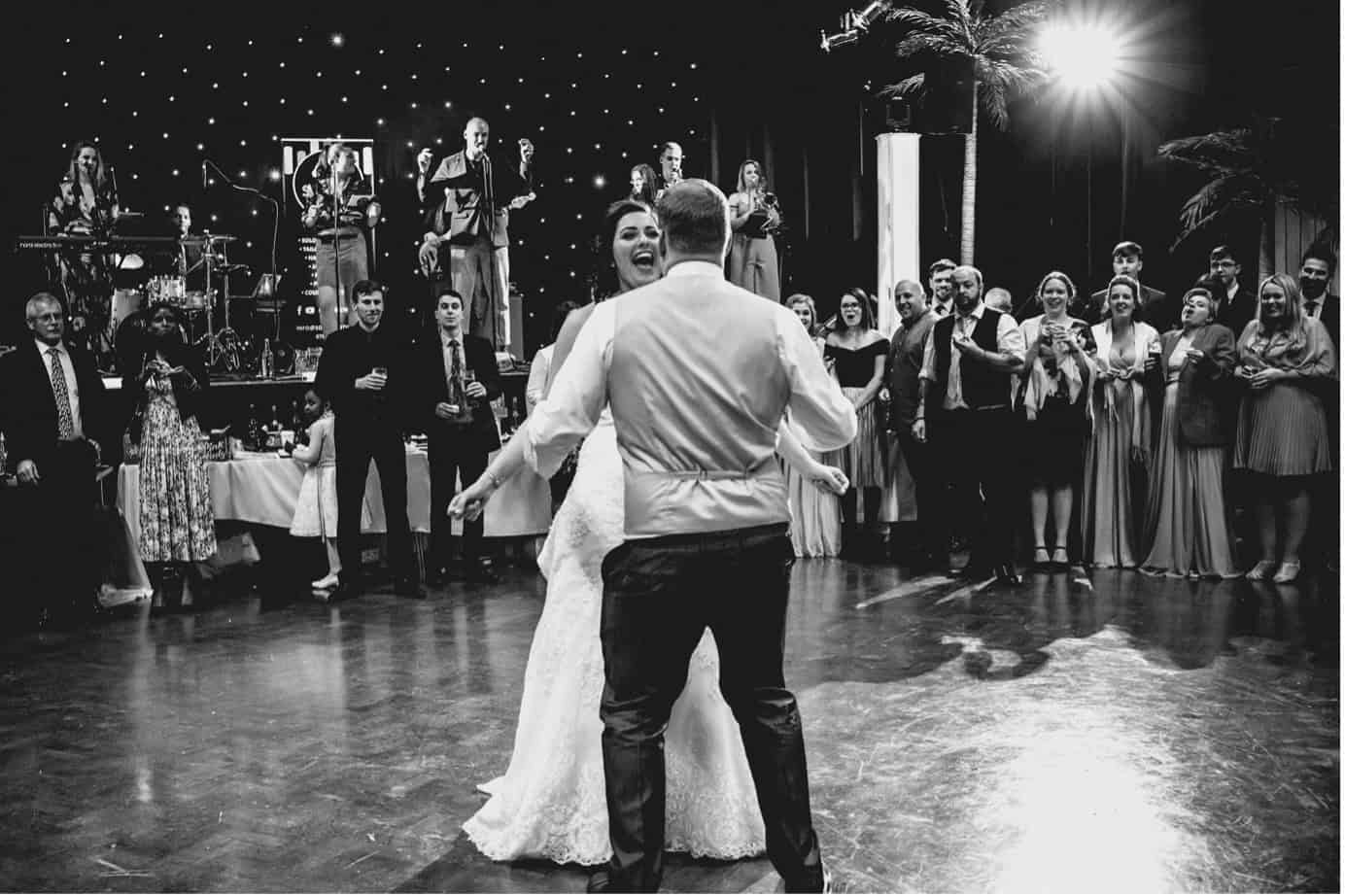 bride and groom first dance with live band